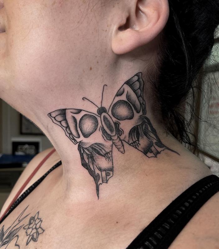 Butterfly skull neck tattoo side