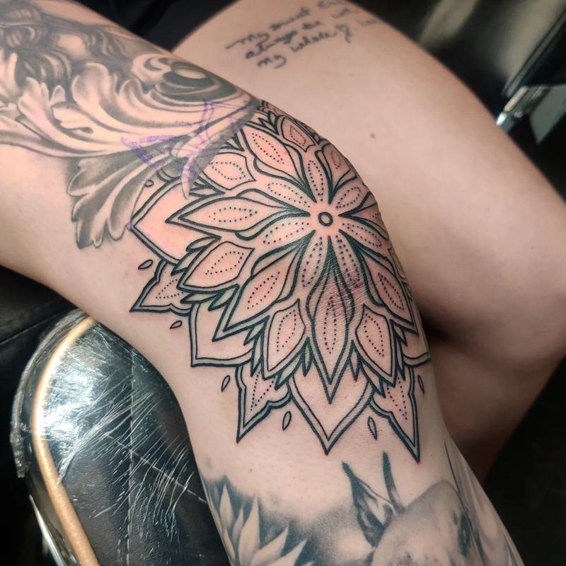 Black flower tattoo below the knee  Tattoogridnet