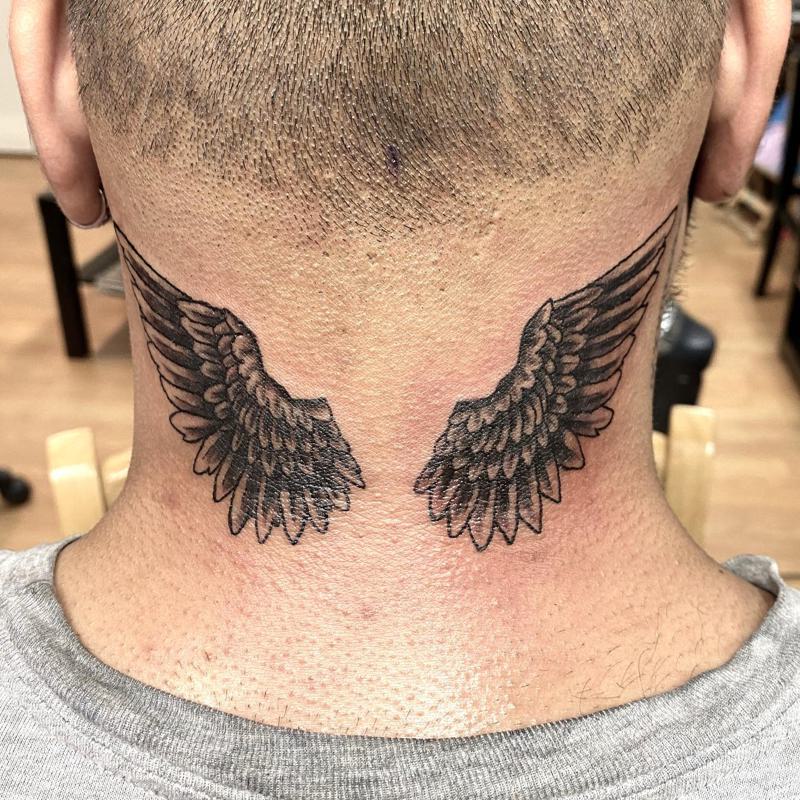 Angel Wing Tattoo on Back of Neck 4