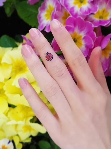 Ladybug Finger Tattoo 3