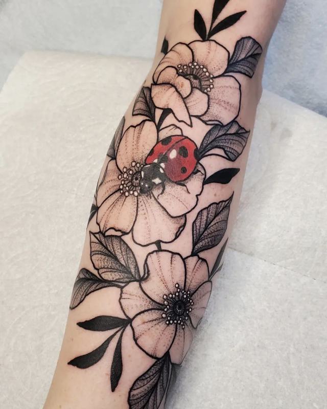 Ladybug on Flower tattoo 1