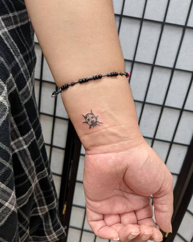 Tiny Ladybug Tattoo 4